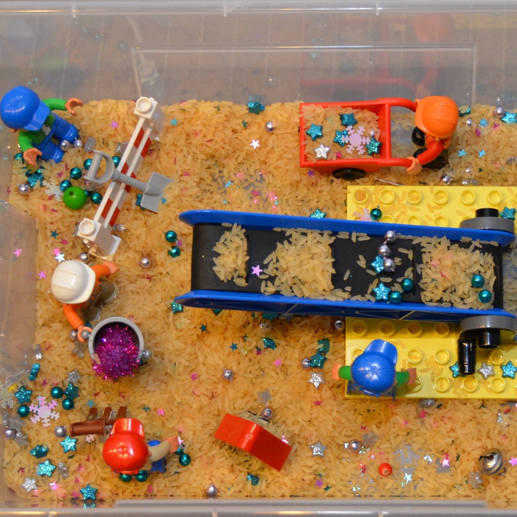 small world play in a rice sensory box